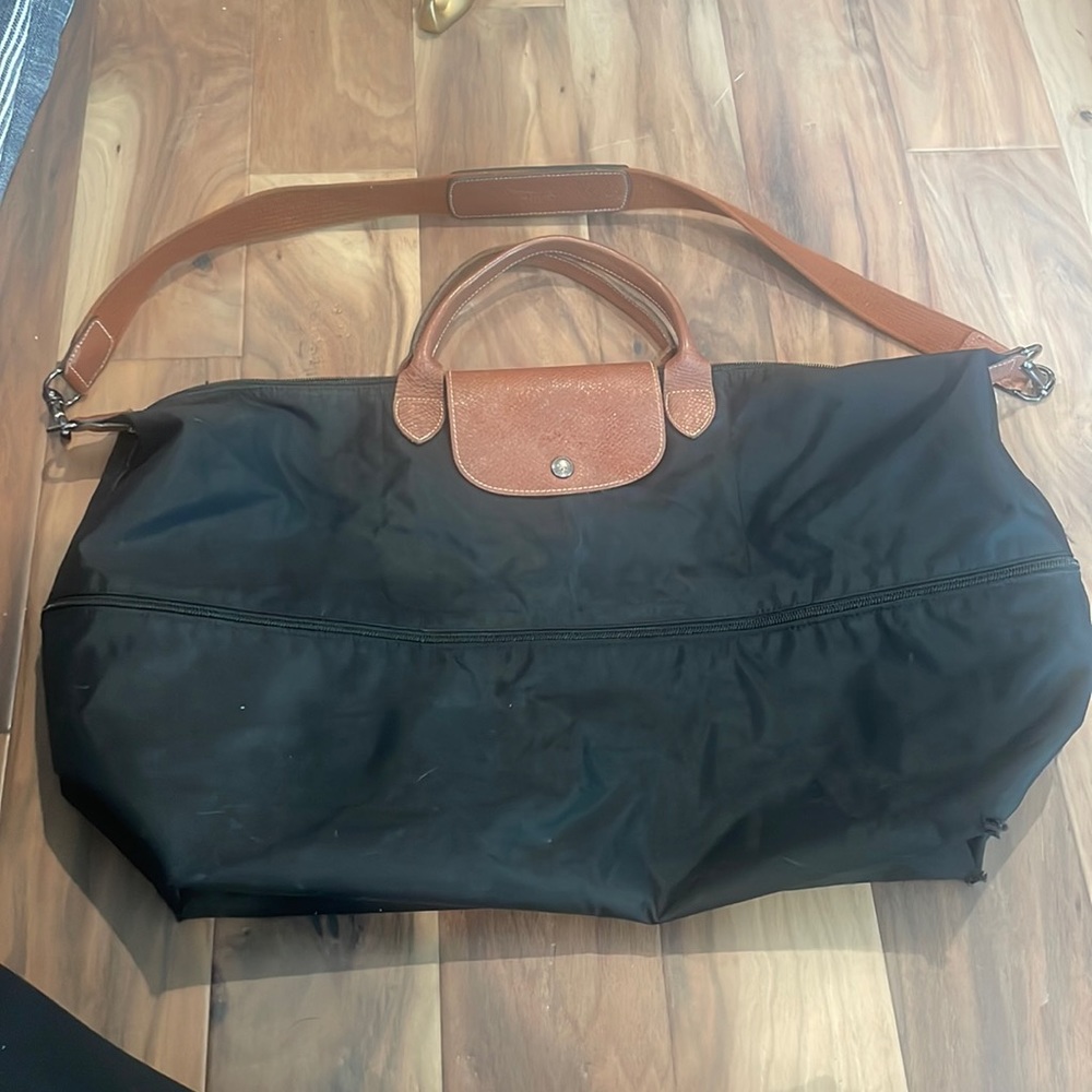Expandable black Longchamp weekend bag - with zip round the middle to expand.